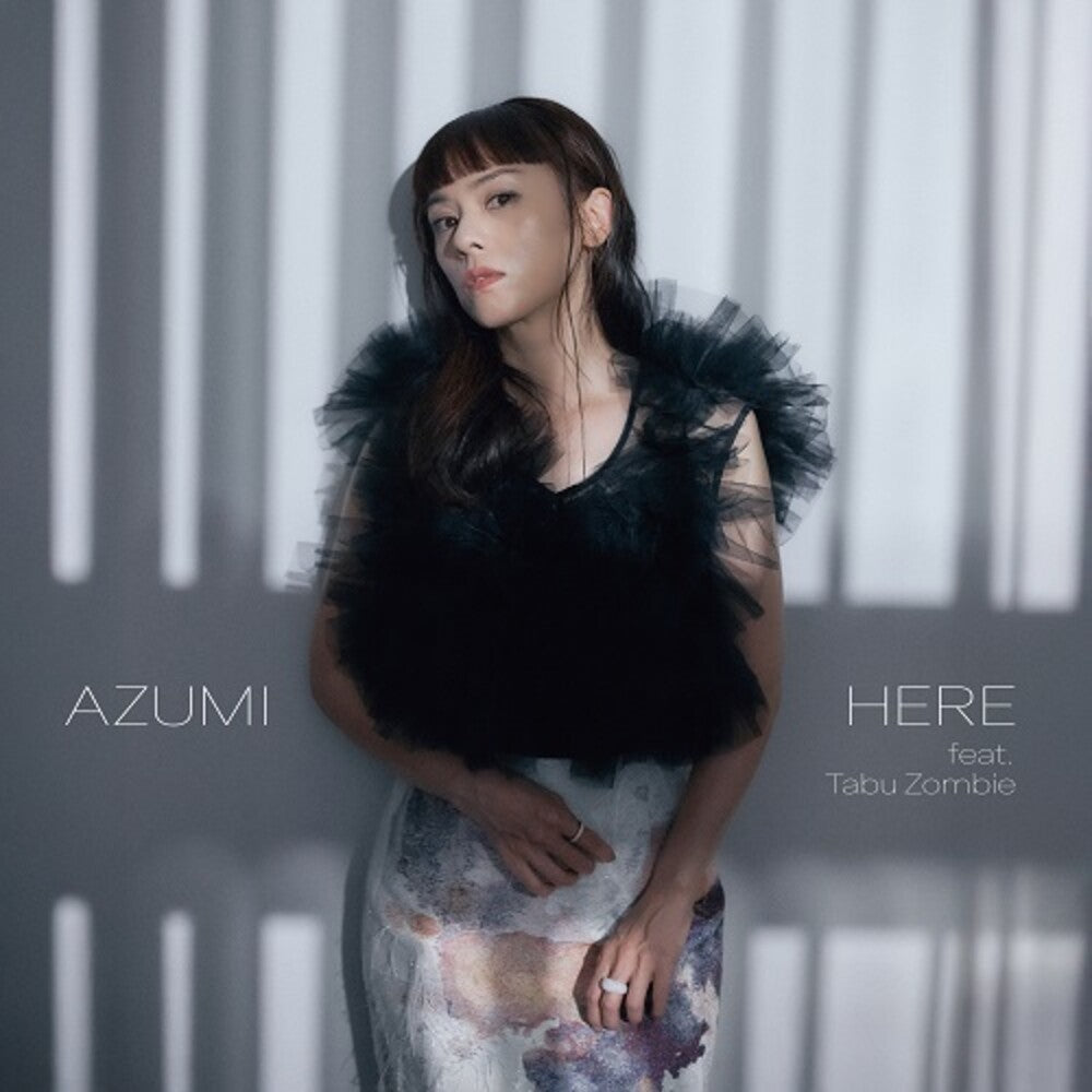 the album cover for Azumi - Here Feat. Tabu Zombie