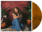 the album cover for Tori Kelly - God Must Really Love Me [Translucent Orange with Black Swirls]