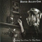 the album cover for David Allan Coe - Standing Too Close To the Flame