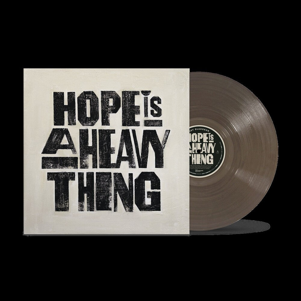 the album cover for Joy Oladokun - Hope Is A Heavy Thing [Transparent Black Ice]